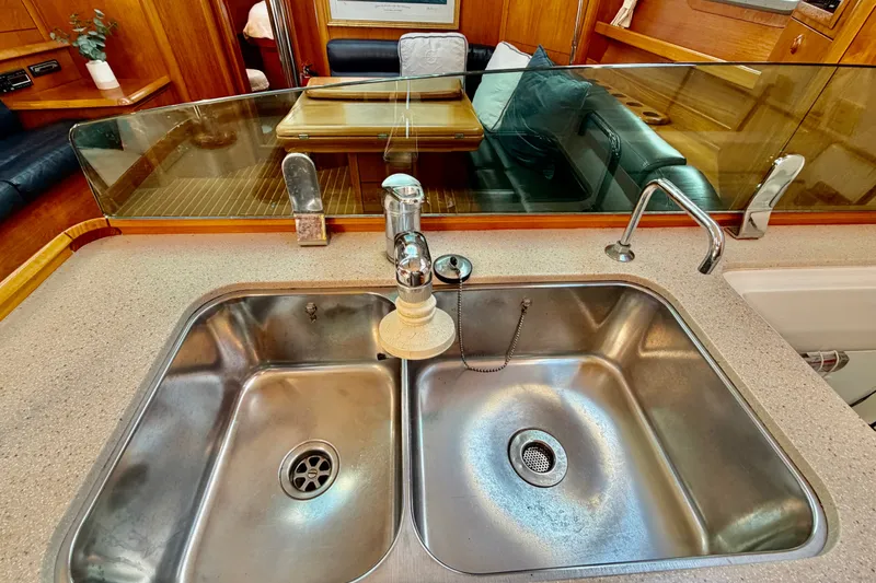 Slide: The Image of Galley sink area in 2007 Jeanneau Sun Odyssey 49 DS yacht interior. - 59