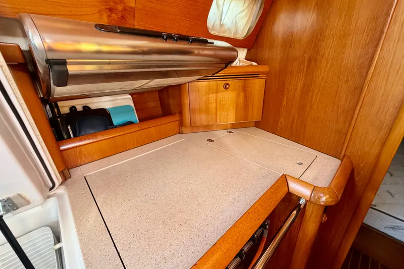 Slide: The Image of 2007 Jeanneau Sun Odyssey 49 DS galley with wooden cabinetry and countertop. - 62