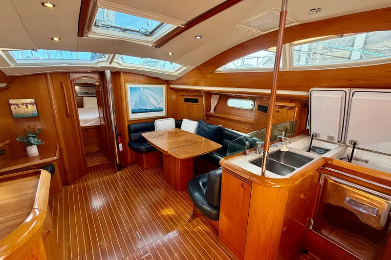 Slide: The Image of Luxurious interior of 2007 Jeanneau Sun Odyssey 49 DS sailboat with wood finish and skylights. - 101