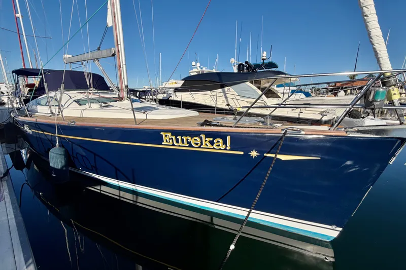 Slide: The Image of Jeanneau Sun Odyssey 49 DS 2007 sailboat named "Eureka!" docked in a marina. - 0