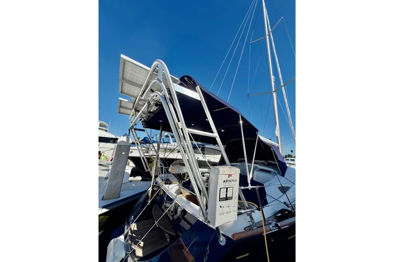 Slide: The Image of 2007 Jeanneau Sun Odyssey 49 DS sailboat with solar panels and blue canopy. - 50