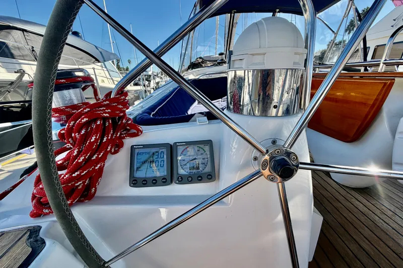 Slide: The Image of Steering wheel and instruments on a 2007 Jeanneau Sun Odyssey 49 DS sailboat. - 33