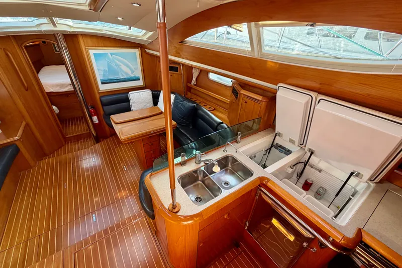 Slide: The Image of Luxurious interior of 2007 Jeanneau Sun Odyssey 49 DS sailboat with wood finish and modern amenities. - 92