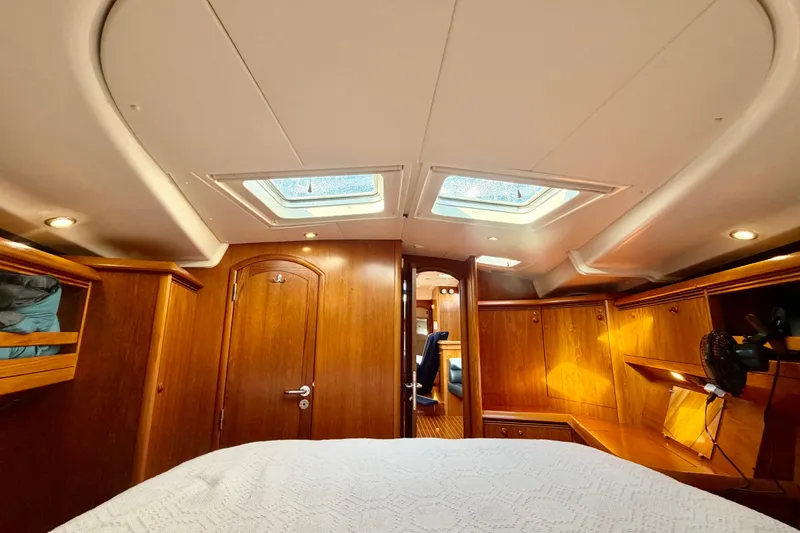 Slide: The Image of Luxurious cabin interior of 2007 Jeanneau Sun Odyssey 49 DS sailboat with wooden finish. - 86
