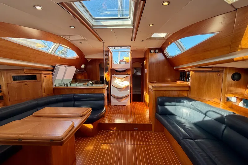 Slide: The Image of Luxurious interior of 2007 Jeanneau Sun Odyssey 49 DS sailboat with wood finish and skylights. - 94