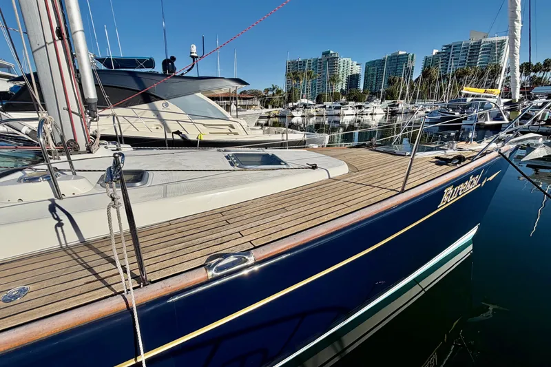 Slide: The Image of 2007 Jeanneau Sun Odyssey 49 DS sailboat docked in marina, clear sky background. - 7