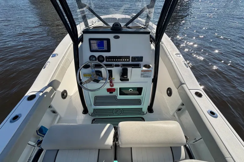 Slide: The Image of 2021 Sea Fox 248 Commander boat cockpit with steering wheel and navigation system. - 8