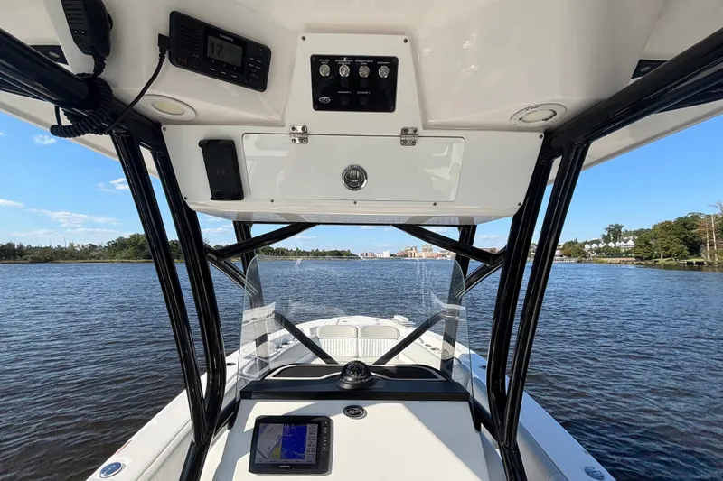 Slide: The Image of 2021 Sea Fox 248 Commander boat interior with navigation system on a calm lake. - 6