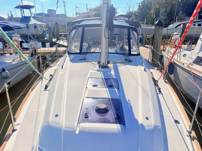 Slide: The Image of The image shows the deck of a 2020 Beneteau Oceanis 35.1 docked at a marina. - 13