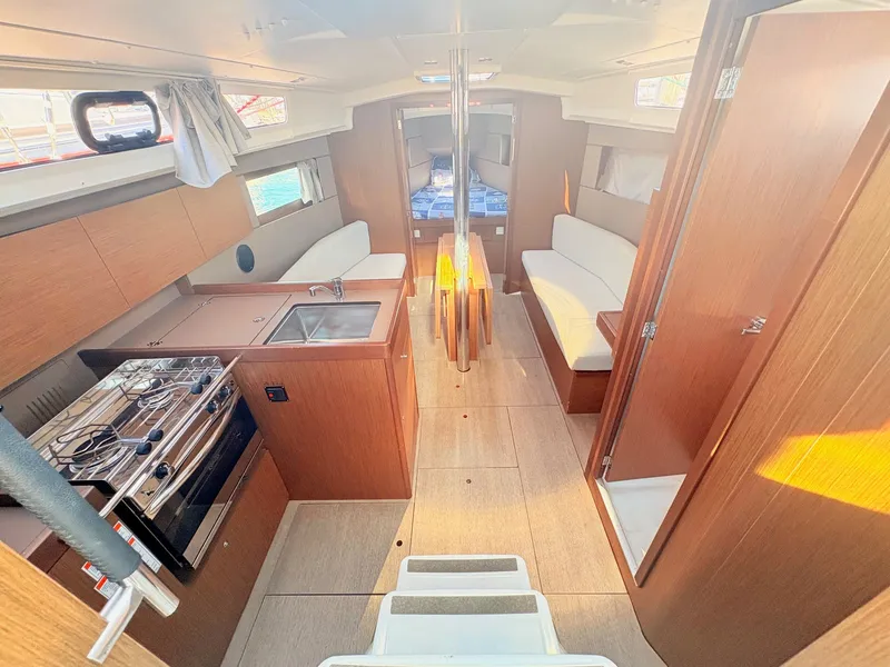 Slide: The Image of Interior of a 2020 Beneteau Oceanis 35.1 with modern kitchen and cozy living area. - 16