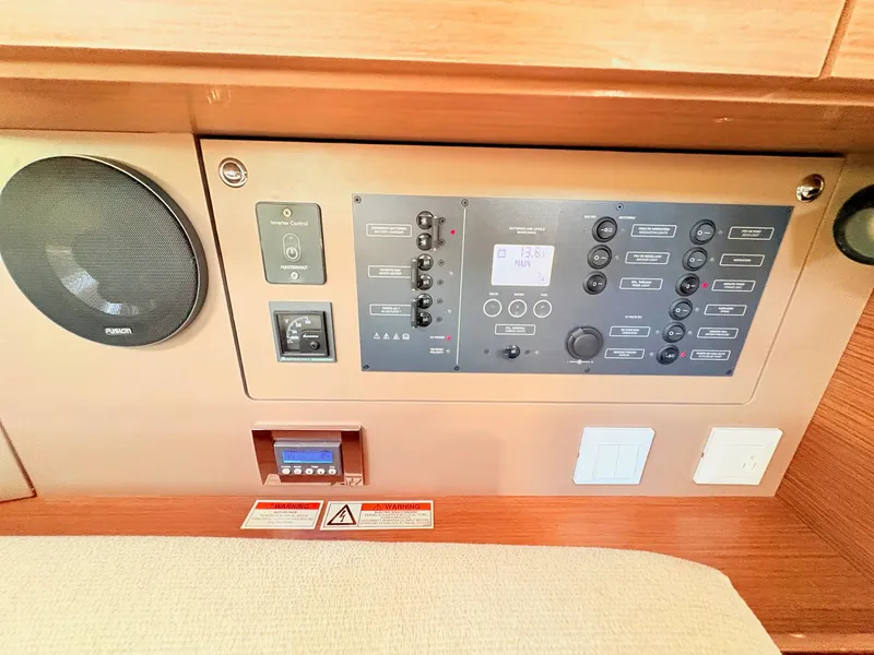 Slide: The Image of The image shows the control panel of a 2020 Beneteau Oceanis 35.1 with various switches and displays. - 22