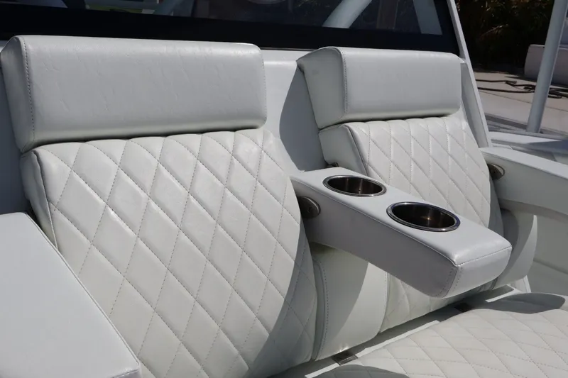 Slide: The Image of Luxurious white leather seating with cup holders on a 2017 Yellowfin 42 Offshore boat. - 18