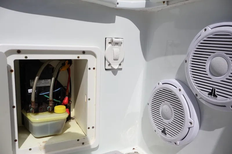 Slide: The Image of 2017 Yellowfin 42 Offshore boat compartment with wiring and JL Audio speakers. - 31