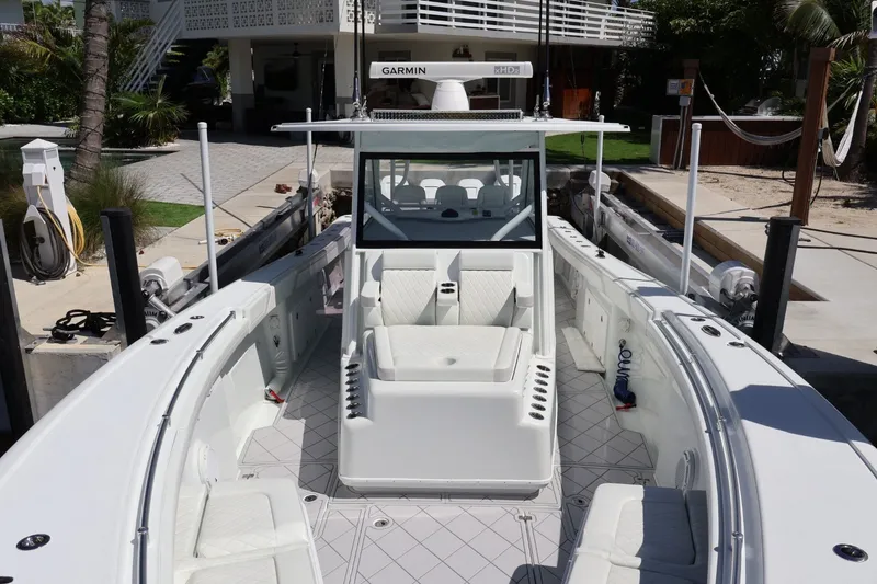 Slide: The Image of 2017 Yellowfin 42 Offshore boat with white seating and Garmin navigation system. - 33