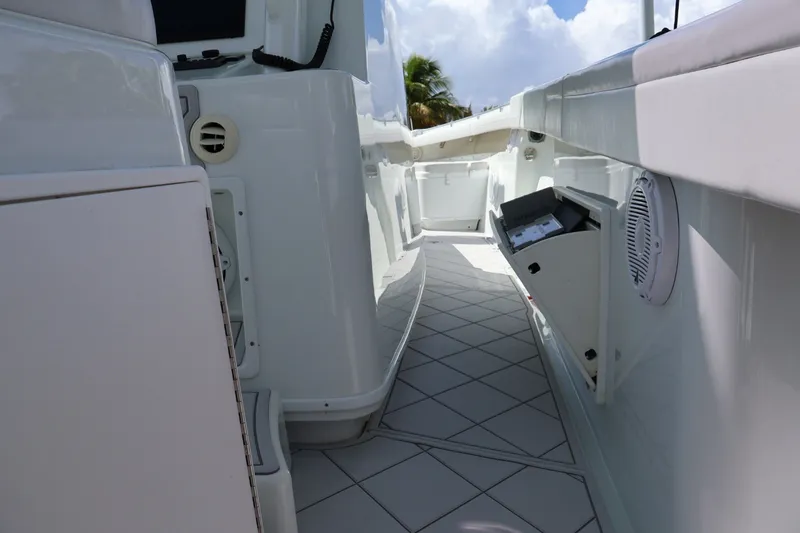 Slide: The Image of 2017 Yellowfin 42 Offshore boat interior with open storage compartments and sleek white design. - 15