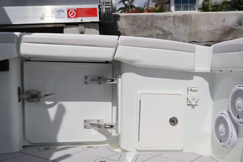 Slide: The Image of 2017 Yellowfin 42 Offshore boat interior with storage compartments and speakers. - 28