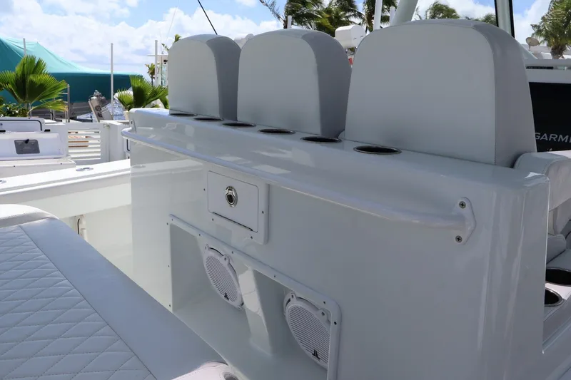 Slide: The Image of 2017 Yellowfin 42 Offshore boat interior with seating and cup holders. - 8