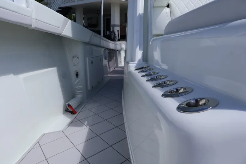 Slide: The Image of 2017 Yellowfin 42 Offshore boat interior with rod holders and sleek white design. - 20