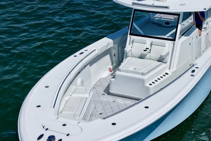 Slide: The Image of 2017 Yellowfin 42 Offshore boat on water, featuring spacious seating and sleek design. - 4
