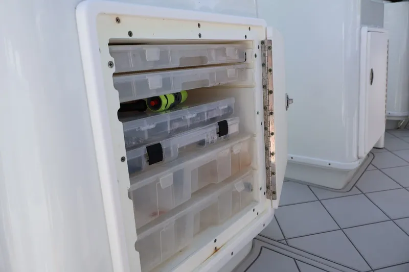 Slide: The Image of Storage compartment with tackle boxes on a 2017 Yellowfin 42 Offshore boat. - 14