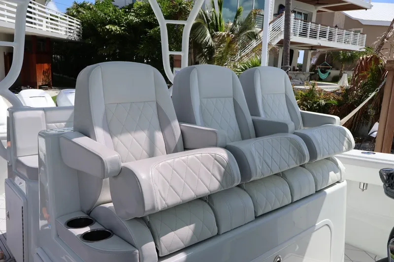 Slide: The Image of Luxurious seating on 2017 Yellowfin 42 Offshore boat, featuring plush, diamond-stitched upholstery. - 9