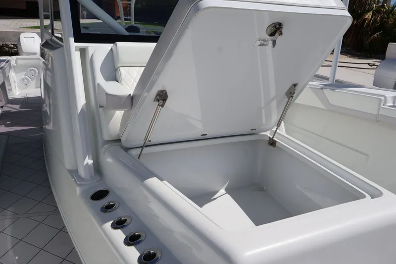 Slide: The Image of 2017 Yellowfin 42 Offshore boat with open storage compartment and rod holders. - 17
