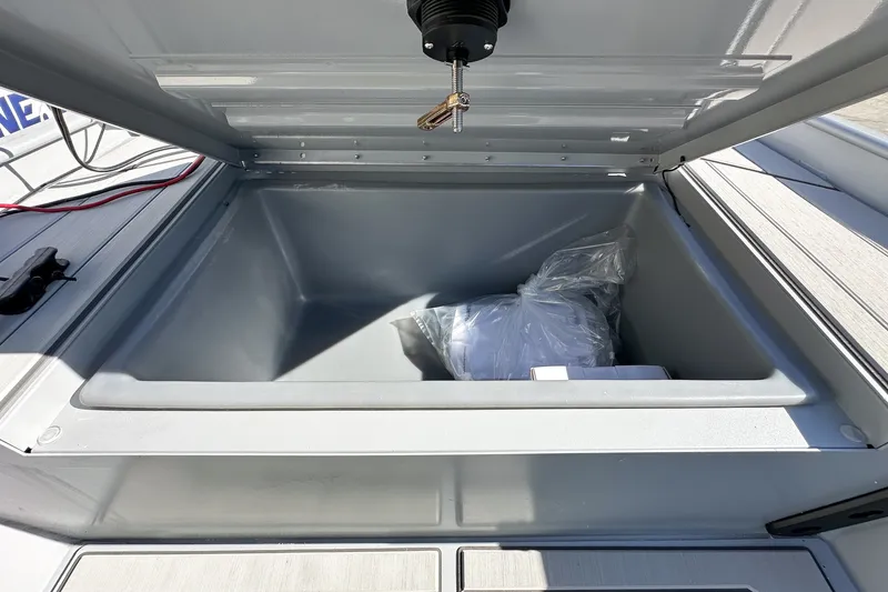 Slide: The Image of Open storage compartment in 2027 Tracker Bass Tracker Classic CC boat. - 14