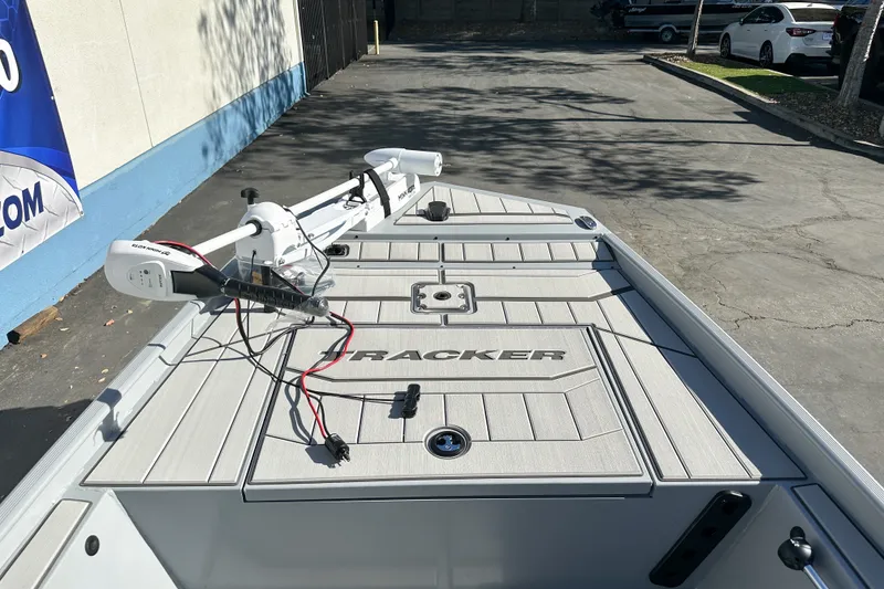 Slide: The Image of 2027 Tracker Bass Tracker Classic CC boat with trolling motor in parking lot. - 13