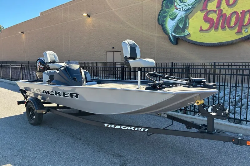 The Image of 2027 Tracker Pro 170 fishing boat on trailer outside store. - 0