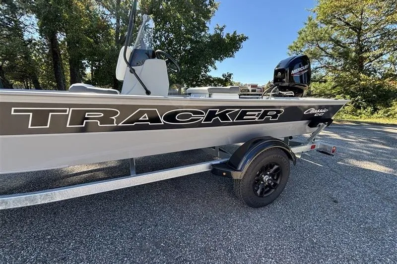 Slide: The Image of 2027 Tracker Bass Tracker Classic CC boat on trailer, parked outdoors. - 14