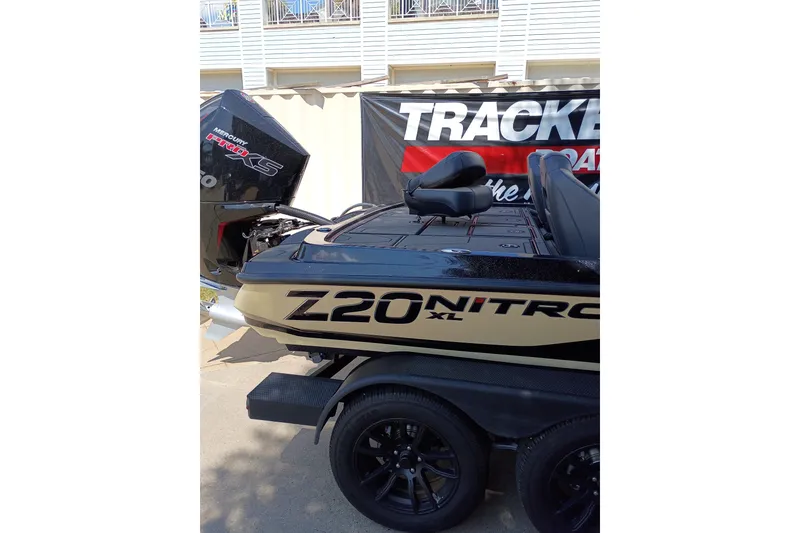 Slide: The Image of 2027 Nitro Z20 XL Pro boat with Mercury Pro XS engine, displayed outdoors. - 5