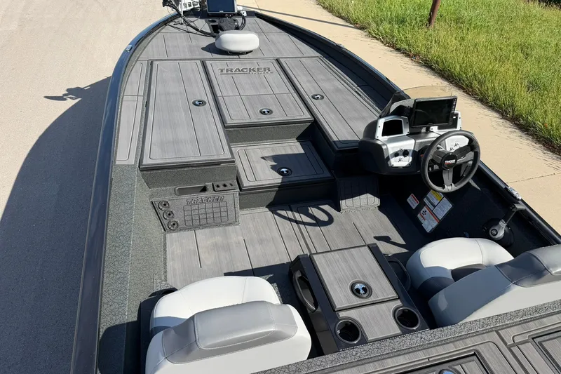 Slide: The Image of 2027 Tracker Savage 215 boat interior with modern dashboard and seating. - 31