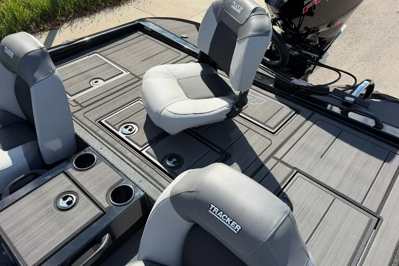 Slide: The Image of 2027 Tracker Savage 215 boat interior with gray seating and storage compartments. - 29
