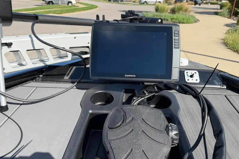Slide: The Image of 2027 Tracker Savage 215 boat dashboard with Garmin navigation system. - 14