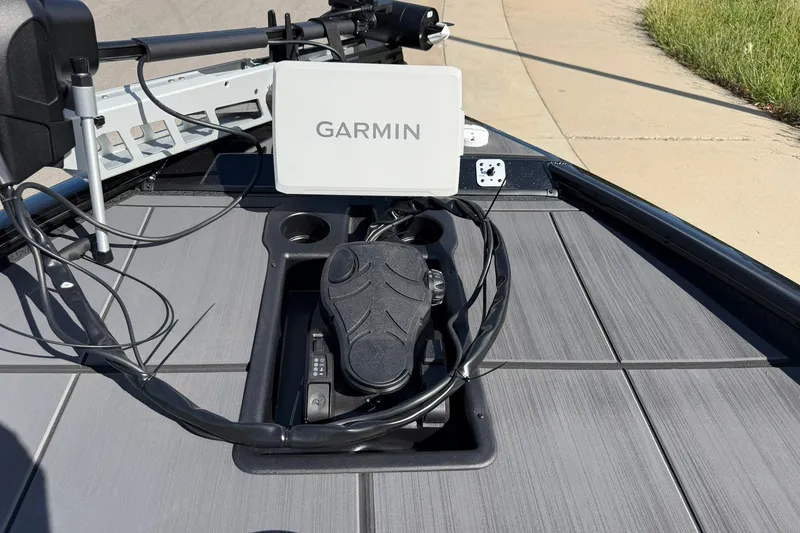 Slide: The Image of 2027 Tracker Savage 215 boat deck with Garmin navigation system and foot pedal. - 13