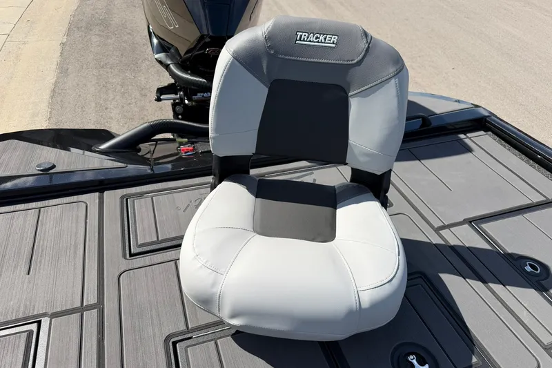 Slide: The Image of 2027 Tracker Savage 215 boat seat on deck, featuring sleek design and durable materials. - 28