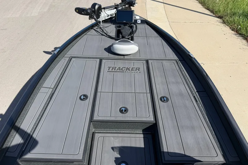 Slide: The Image of 2027 Tracker Savage 215 boat deck with advanced navigation equipment. - 21