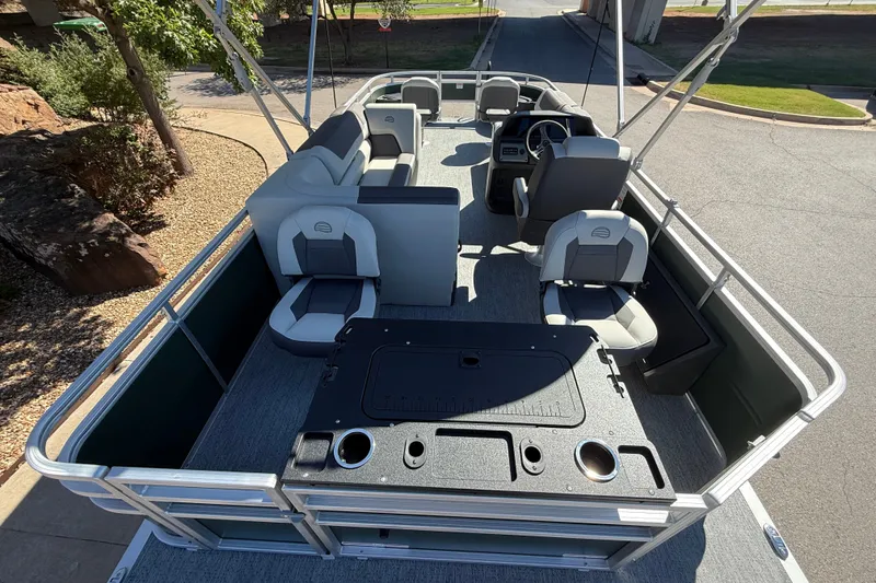 Slide: The Image of 2027 Sun Tracker Fishin' Barge 22 DLX pontoon boat with spacious seating and fishing amenities. - 12