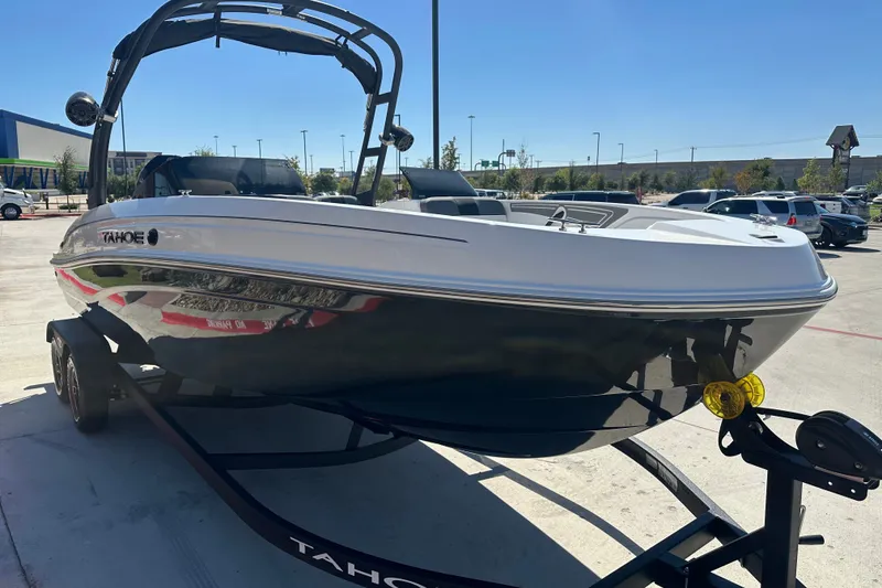 Slide: The Image of 2027 Tahoe T21 boat on trailer in sunny outdoor setting. - 5