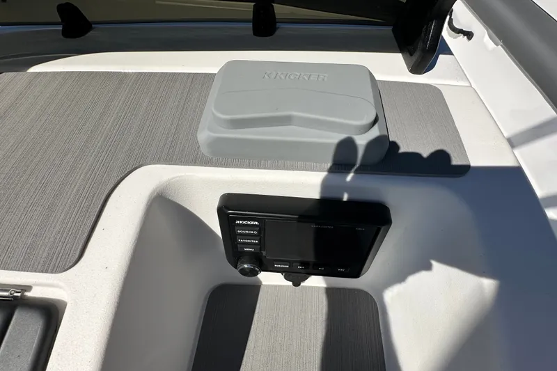Slide: The Image of Interior of 2027 Tahoe T21 boat featuring Kicker audio system and sleek design. - 12