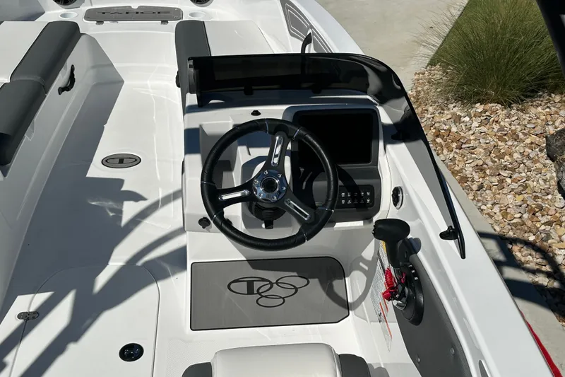 Slide: The Image of Steering console of 2027 Tahoe T21 boat with modern controls and sleek design. - 18