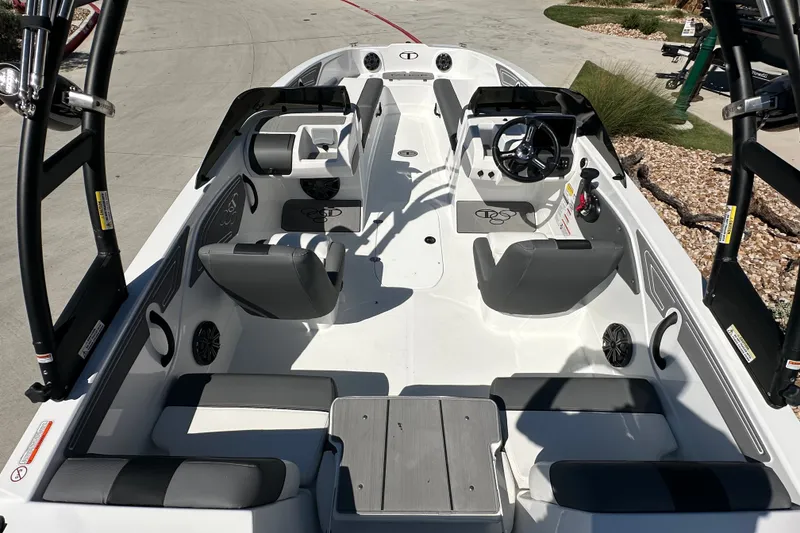 Slide: The Image of 2027 Tahoe T21 boat interior with seating, steering wheel, and modern design features. - 9