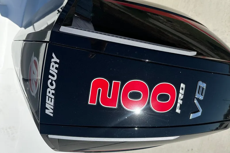 Slide: The Image of Outboard motor with Mercury branding on a 2027 Tahoe T21 boat. - 8