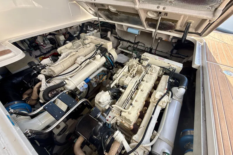 Slide: The Image of Engine compartment of a 2005 Sea Ray 420 Sundancer yacht, showcasing dual engines. - 30
