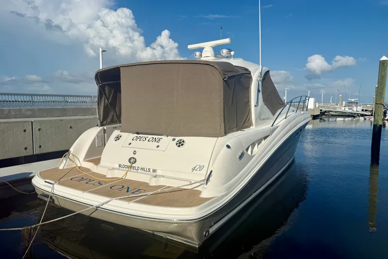 Slide: The Image of 2005 Sea Ray 420 Sundancer yacht docked at marina under blue sky. - 34