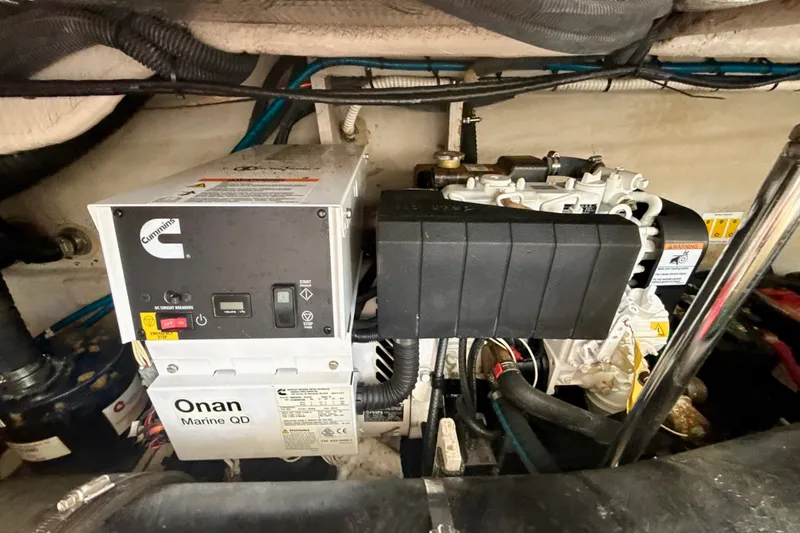 Slide: The Image of Engine room of 2005 Sea Ray 420 Sundancer with Cummins Onan Marine QD generator. - 31