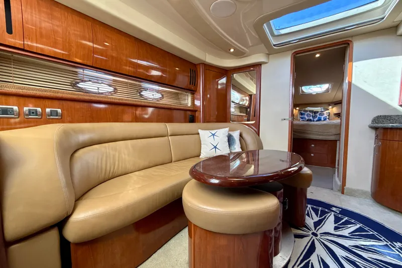 Slide: The Image of Luxurious interior of 2005 Sea Ray 420 Sundancer yacht with leather seating and elegant wood finishes. - 16
