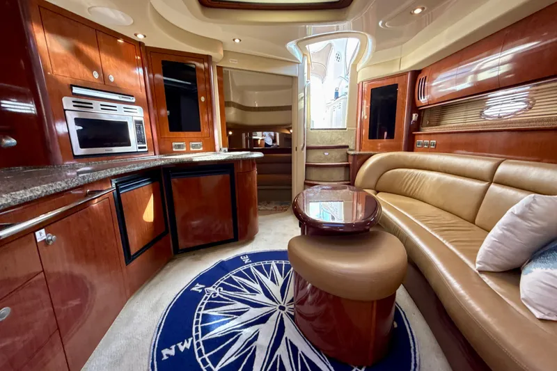 Slide: The Image of Luxurious interior of 2005 Sea Ray 420 Sundancer yacht with elegant wood finishes. - 22
