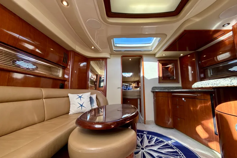 Slide: The Image of Luxurious interior of 2005 Sea Ray 420 Sundancer yacht with elegant wood finishes and skylight. - 17
