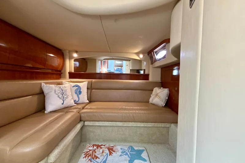 Slide: The Image of Luxurious interior of 2005 Sea Ray 420 Sundancer yacht with plush seating and nautical decor. - 23